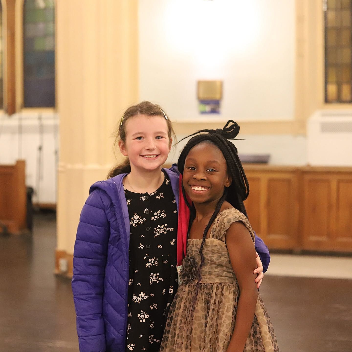 Two friends celebrating after the recital